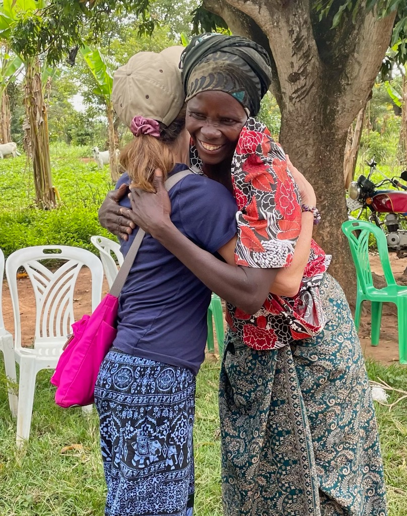 Founder Joanne Trangle hugging a community member in Uganda
