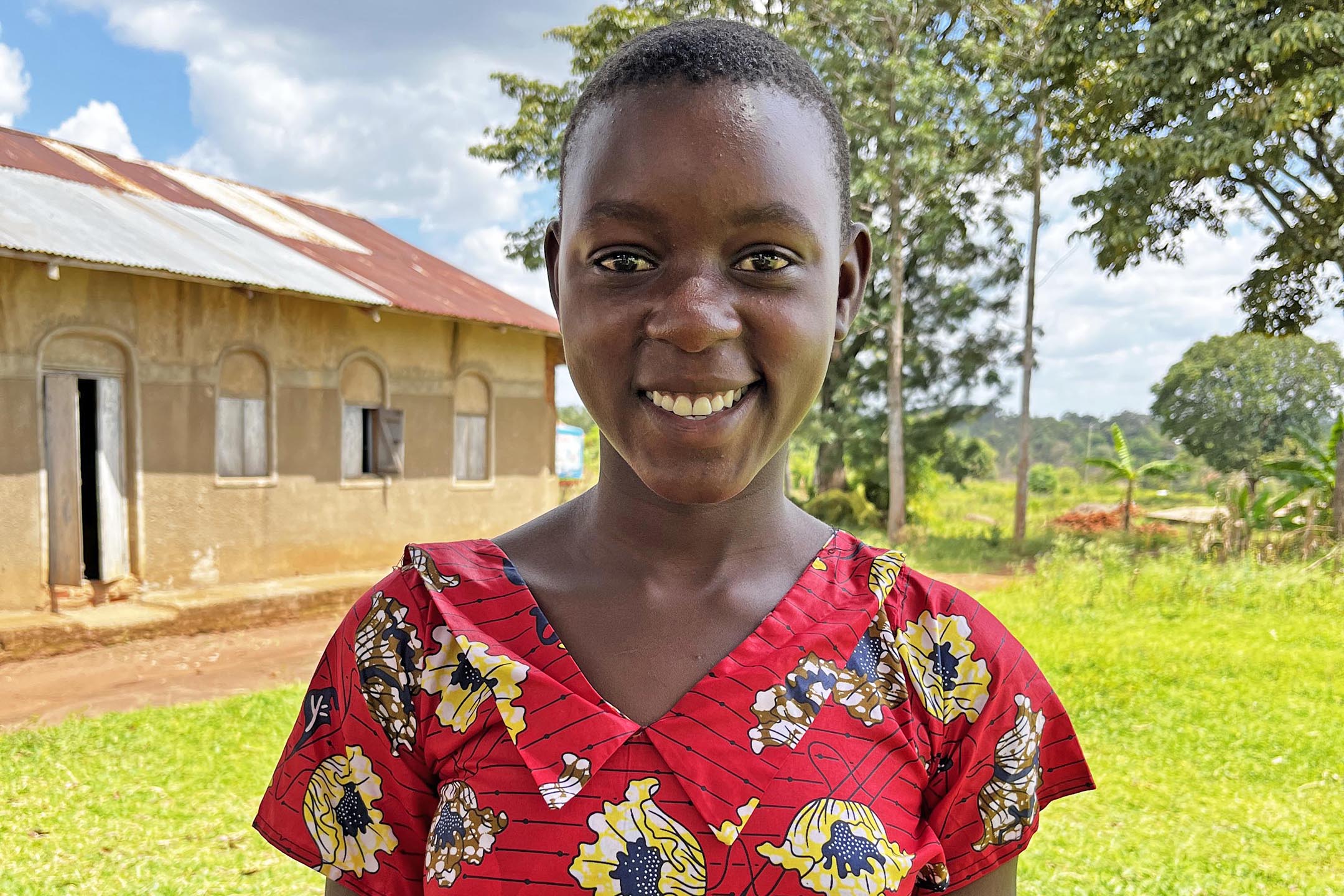 School girls at Buyanga Farm School in Uganda holding their reusable menstrual hygiene kits