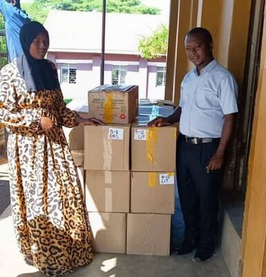 Recipients at Hadassah Primary School standing proudly with their boxes of books