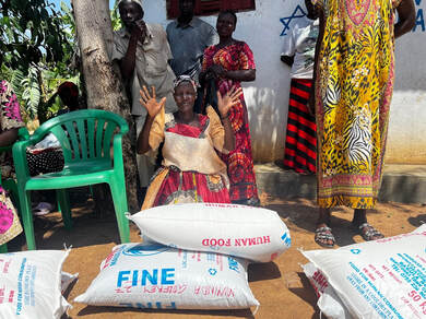 Distributed posho and beans packages at the synagogue distribution point