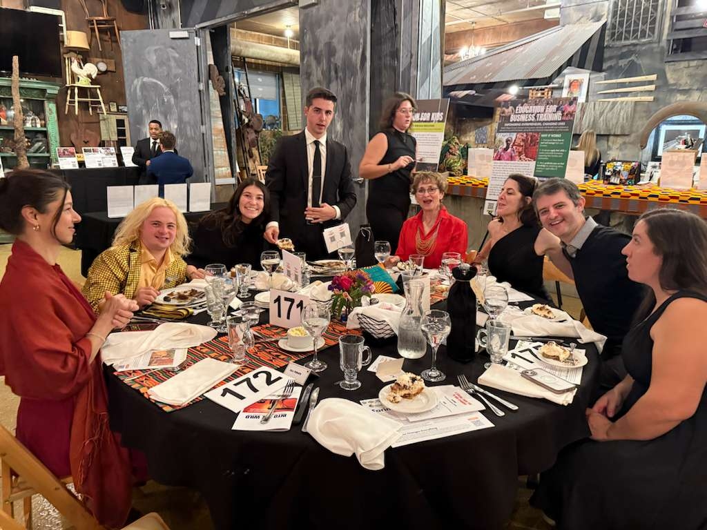 Guests enjoying a safari-style journey evening together at the Into the Wild Gala dining tables